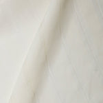 A draped swatch of sheer linen fabric in a cream color with a subtle striped pattern.