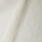 A draped swatch of sheer linen fabric in a cream color with a subtle striped pattern.