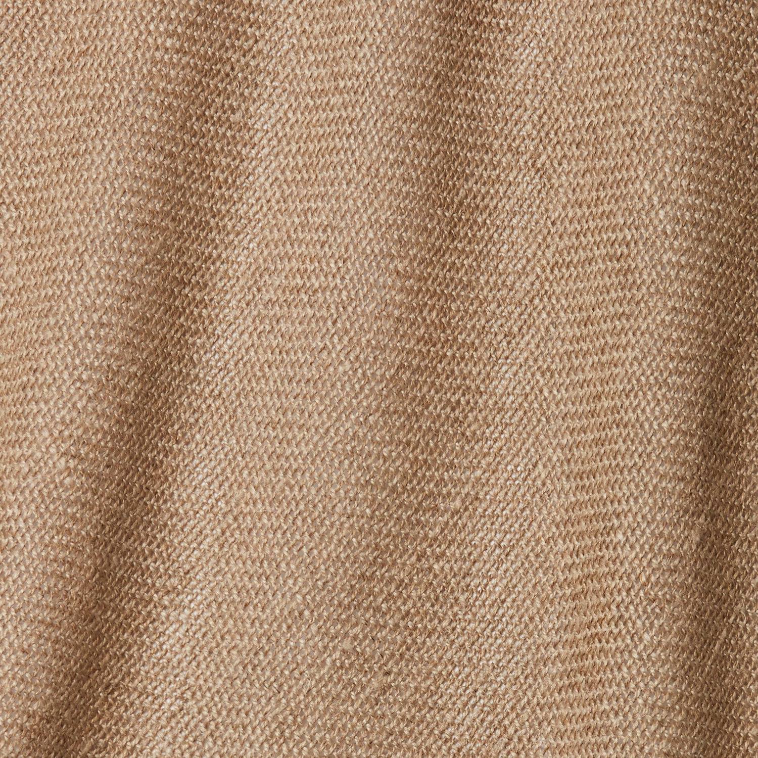 A draped swatch of open-weave sheer interior fabric in a tan color.