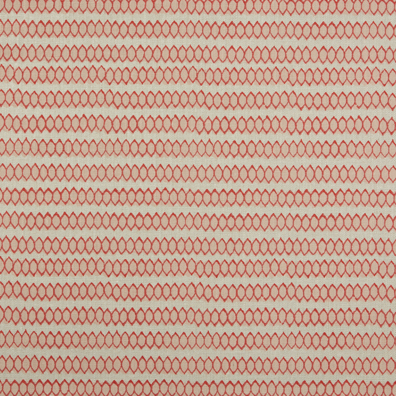 Swatch of fabric with rows of hand-drawn red and peach honeycomb shapes on a tan background.