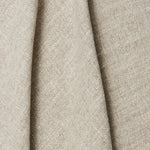 Normandy Fabric shown draped in a stone grey neutral color