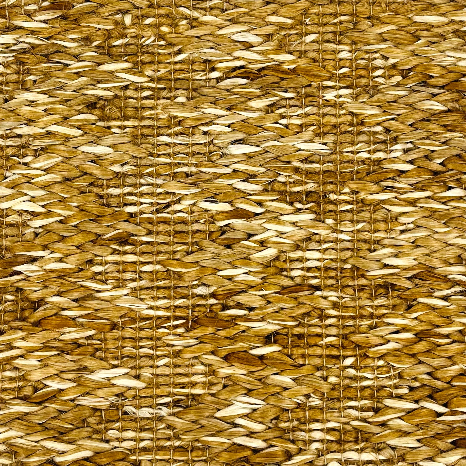 Woven rug swatch in natural fibers in a subtle striated stripe pattern