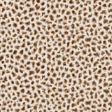 Detail of fabric in a painterly animal print in brown and tan on a cream field.