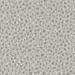 Detail of fabric in a painterly animal print in white and gray on a light gray field.