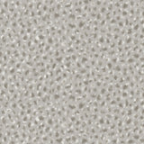 Detail of fabric in a painterly animal print in white and gray on a light gray field.