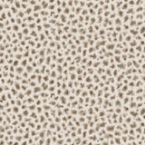 Detail of fabric in a painterly animal print in brown and gray on a cream field.