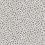 Detail of wallpaper in a painterly animal print in white and gray on a light gray field.