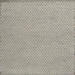 Textured rug with a herringbone pattern in white and grey