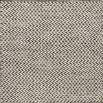 Textured rug with a herringbone pattern in white and charcoal grey