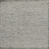 Textured rug with a herringbone pattern in white and slate blue. 