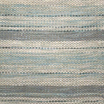 Handwoven rug detail in a stripe design in blue and grey 