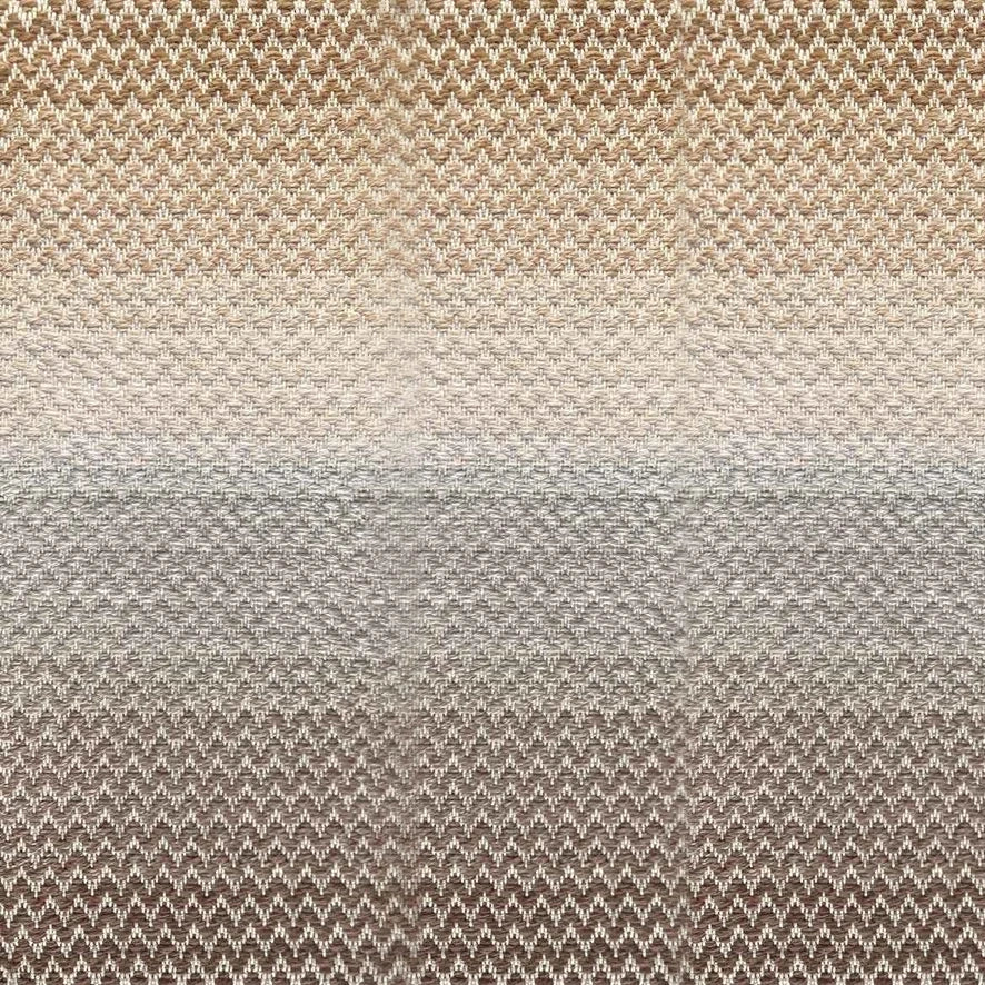 Broadloom carpet in a herringbone pattern in a subtle ombré color from warm brown to tan.