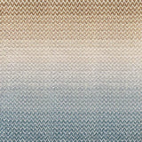 Broadloom carpet in a herringbone pattern in a subtle ombré color from teal blue to warm sand.