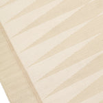 Handwoven rug in a geometric design in shades of beige. 