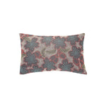 Rectangular throw pillow with a dimensional floral embroidery pattern in shades of coral, blue, white and yellow on a gray field.