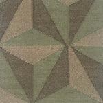 Close-up of a geometric patterned rug with shades of green, grey and brown.