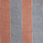 Detail of fabric in an irregular stripe print in red and navy on a white field.