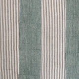 Detail of fabric in an irregular stripe print in green and brown on a white field.