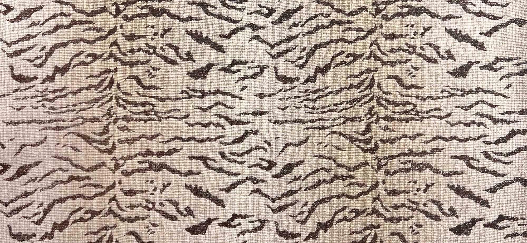 Broadloom carpet in a tiger inspired pattern in shades of brown.