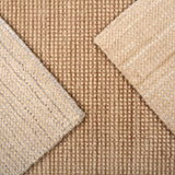 Close up of broadloom carpet samples in neutral colors. 