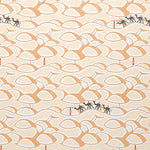 Detail of wallpaper in a playful sand dune and camel print in orange, yellow and black.