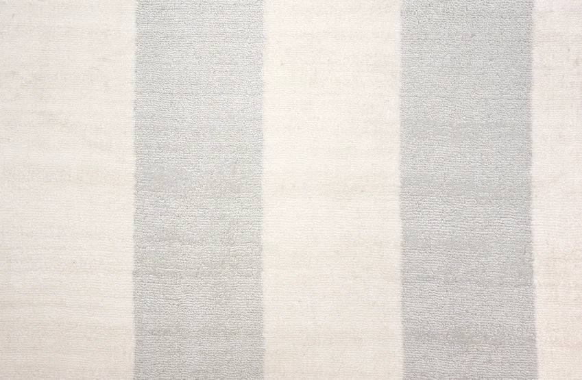 Broadloom carpet swatch in a stripe pattern in a light grey design