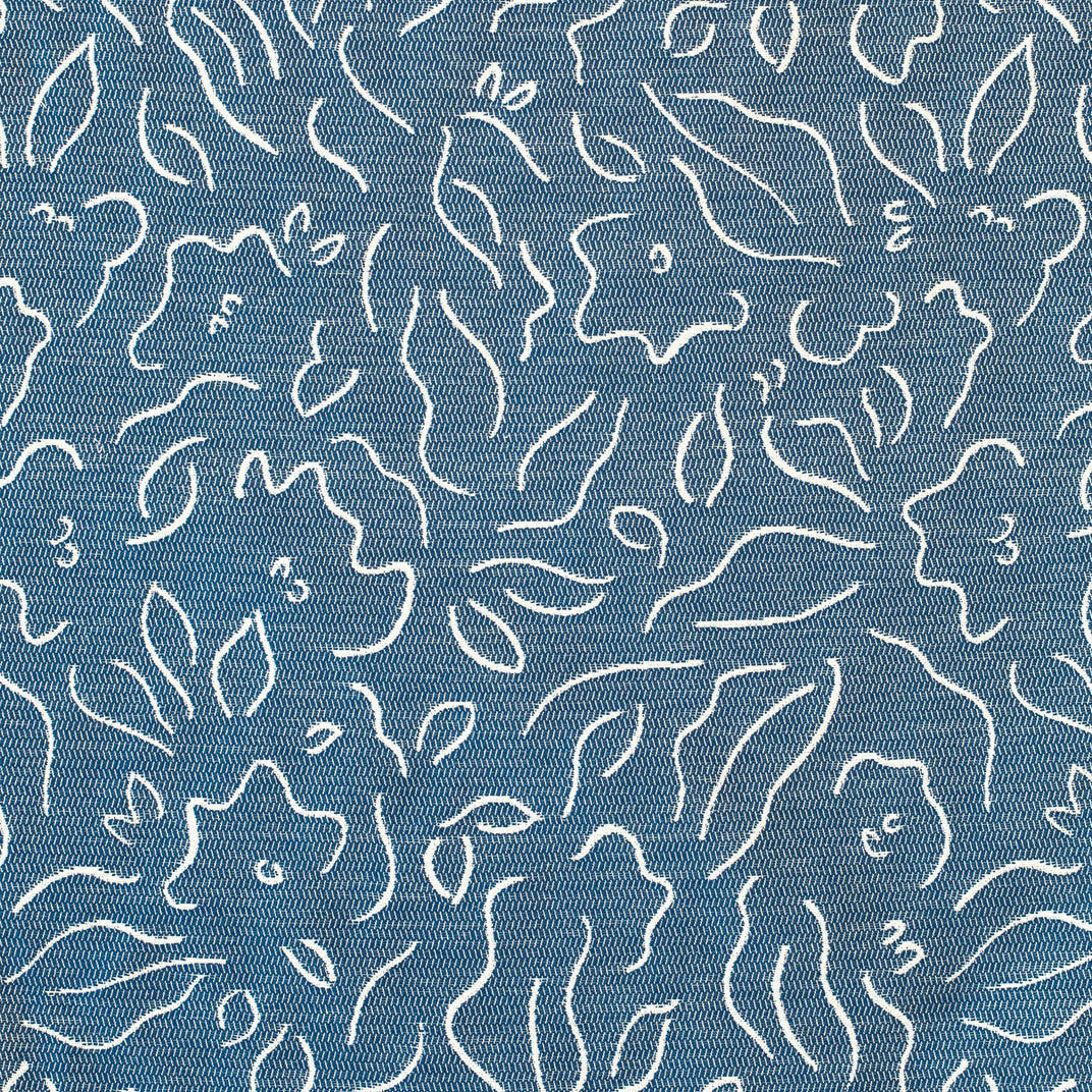 Detail of fabric in a minimalist floral print in cream on a navy field.