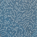 Detail of fabric in a minimalist floral print in cream on a navy field.