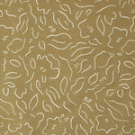 Detail of fabric in a minimalist floral print in cream on a brown field.