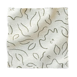 Square fabric swatch in a minimalist floral print in olive on a cream field.