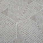 Broadloom carpet sample in a geometric linear pattern in cream on a tan field. 