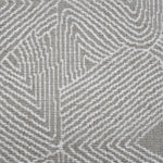 Broadloom carpet sample in a geometric linear pattern in cream on a taupe field. 