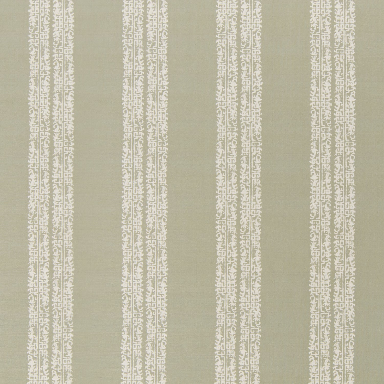 printed linen fabric in a scrolling floral stripe pattern in cream on a light sage field.