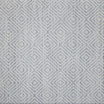 Broadloom carpet swatch in a geometric pattern in a blue design