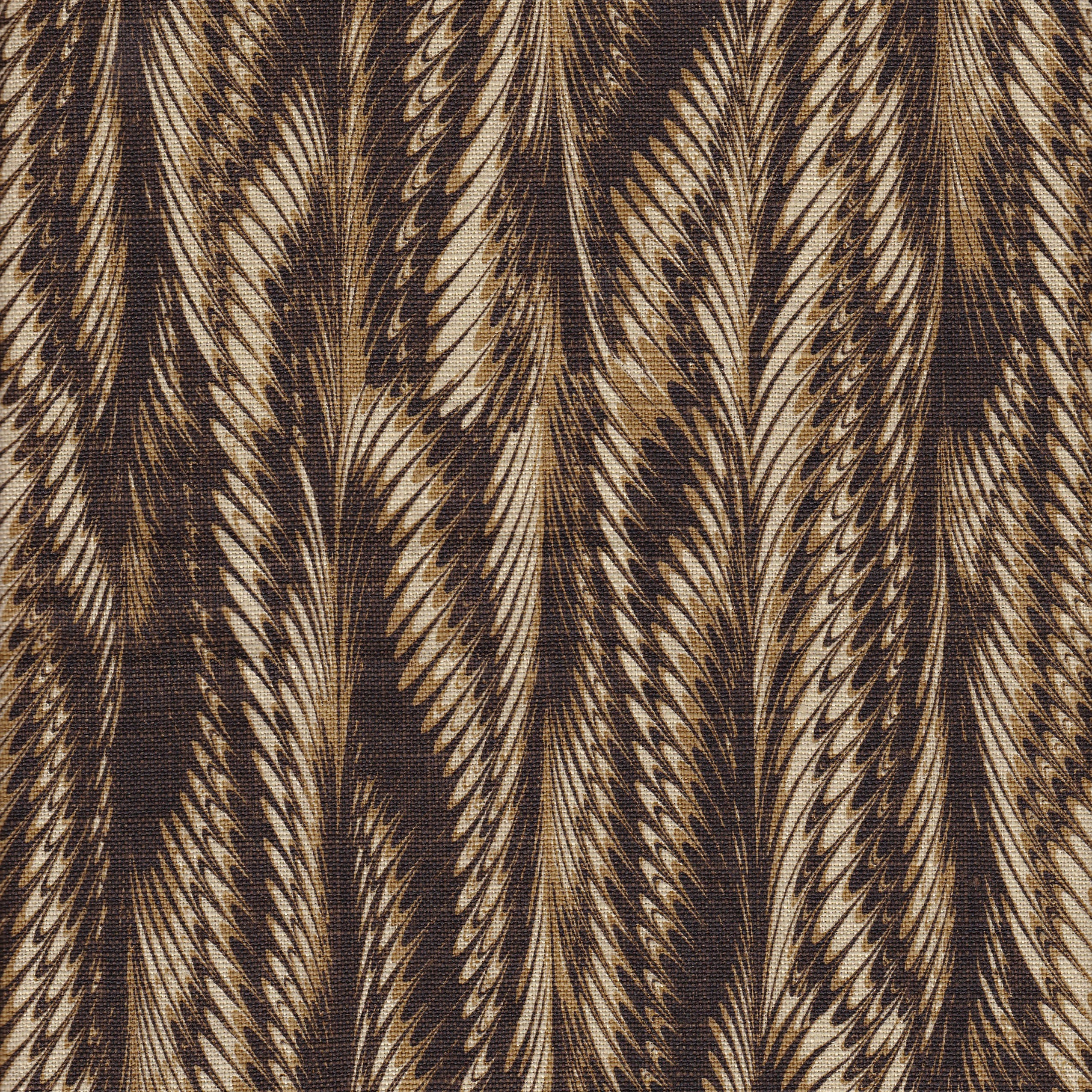 Detail of fabric in a marbled paint print in shades of brown and tan.