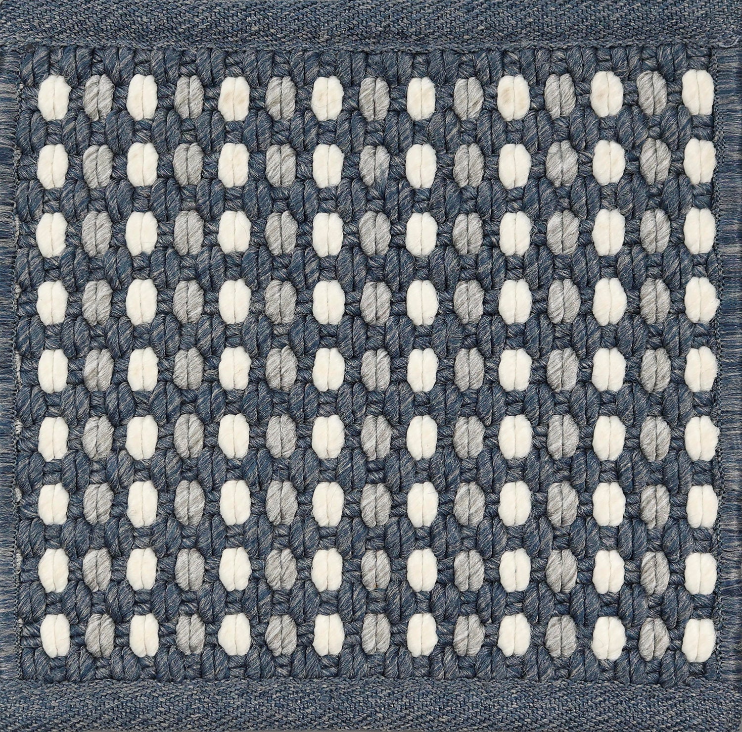 Textured woven outdoor carpet a dashed stripe in white, grey and navy blue.