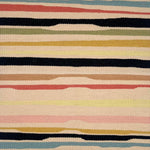 Detail of a flatwoven rug with a light tan ground and undulating stripes in medium blue, clay red, black, sage green, gold, tan, pale pink, and black.