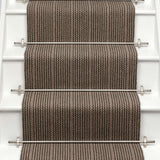 Striped flatweave runner in brown and red on white staircase