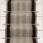 Striped flatweave runner in grey and black on white staircase