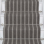 Striped flatweave runner in grey and black on white staircase