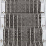 Striped flatweave runner in grey and black on white staircase