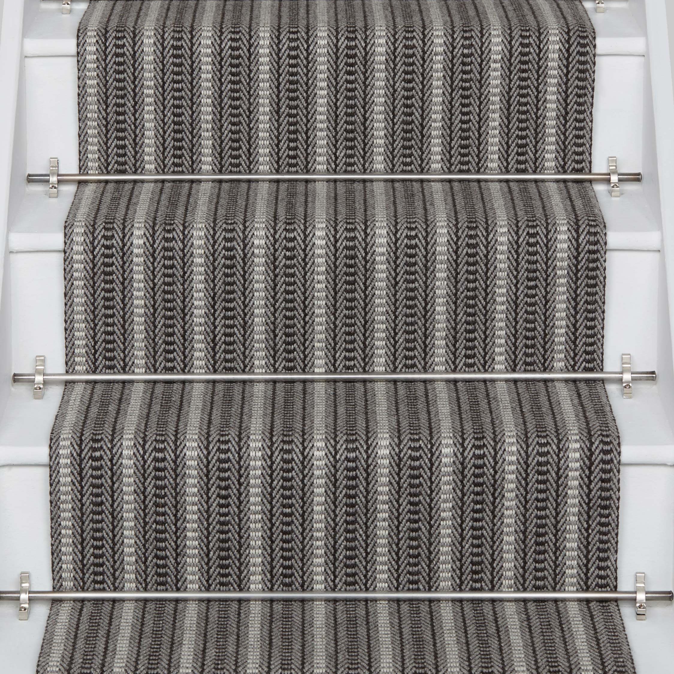 Striped flatweave runner in grey and black on white staircase