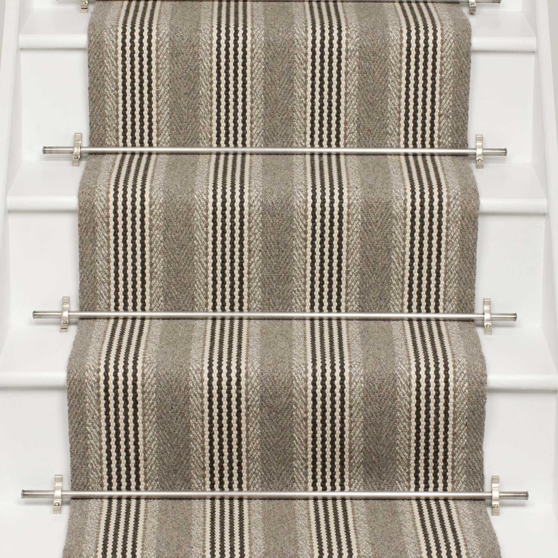 Striped flatweave runner in grey and black on white staircase