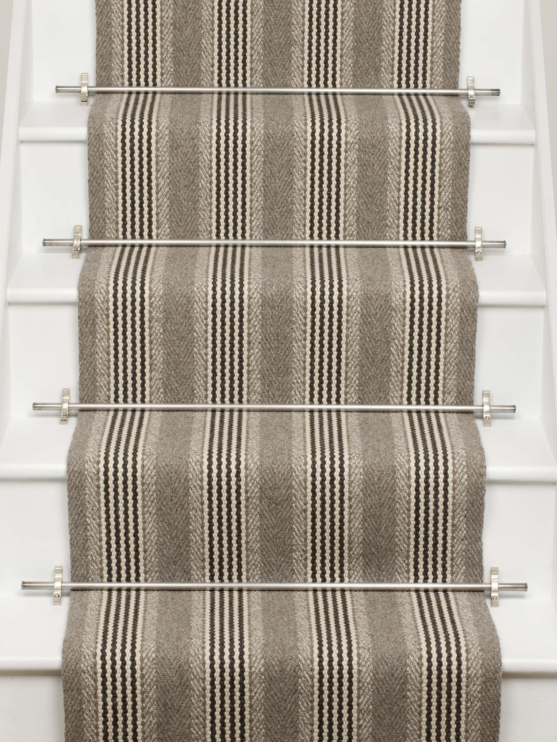 Striped flatweave runner in grey and black on white staircase