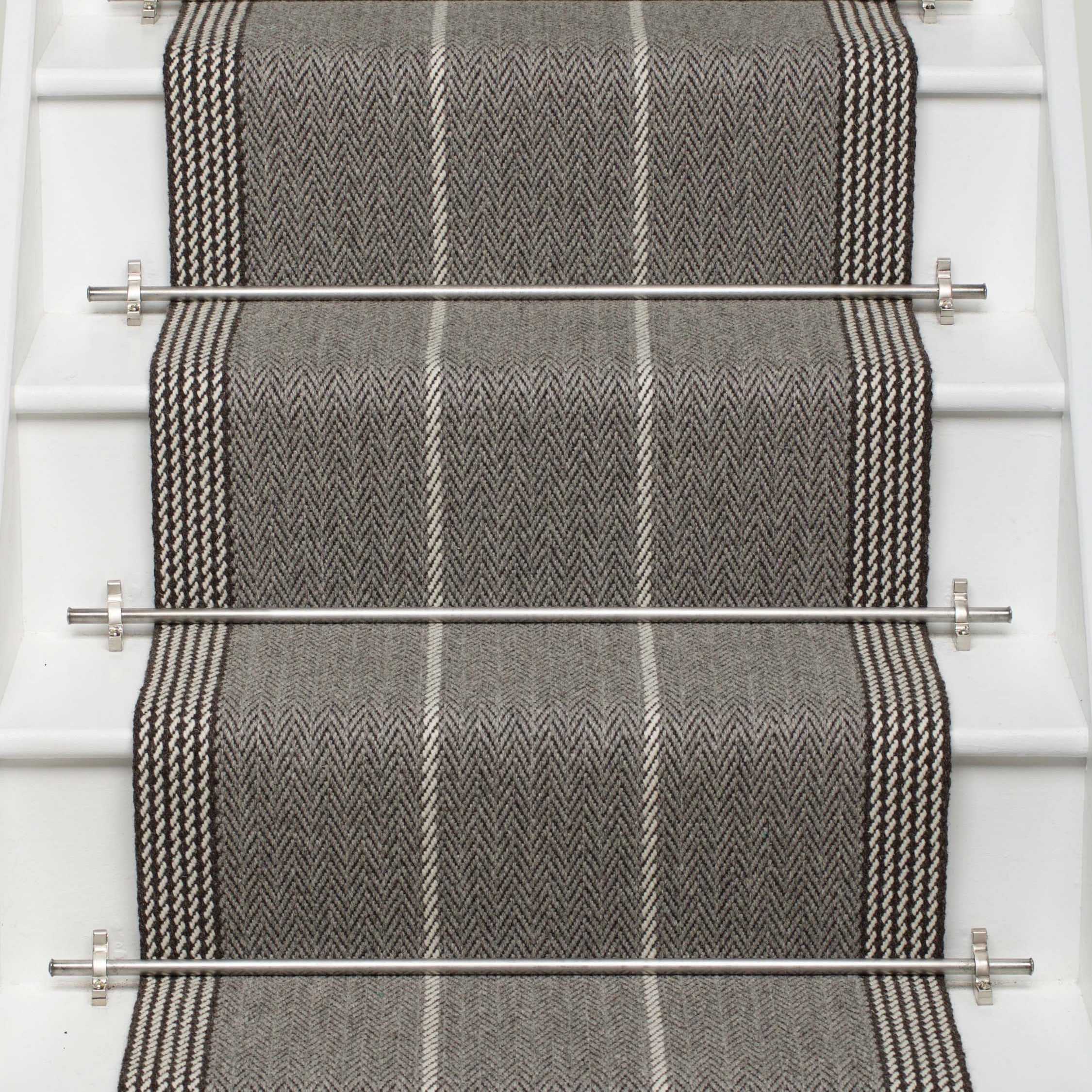 Striped flatweave runner in grey and black on white staircase