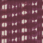 Detail of fabric in a textural shibori print in shades of purple on a greige field.