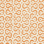 Detail of fabric in a curvilinear stripe pattern in orange on a cream field.