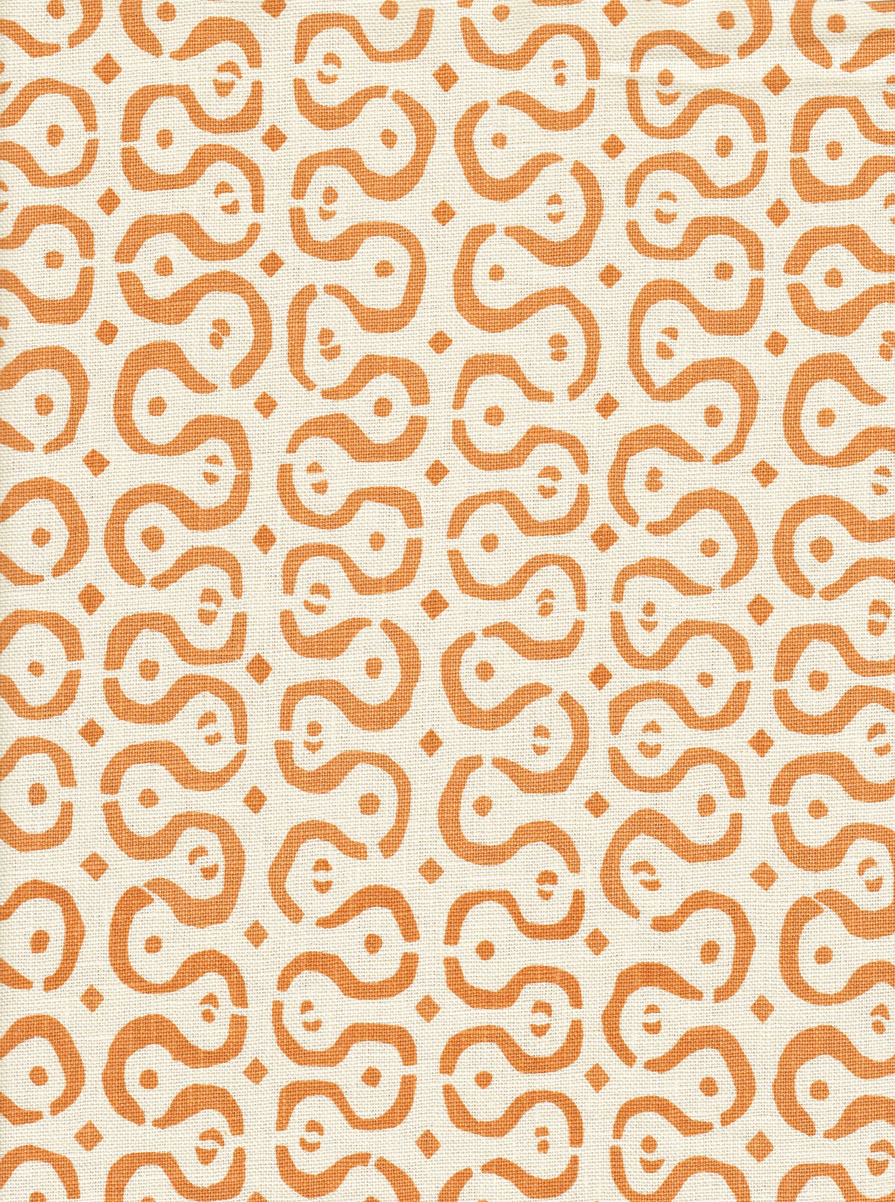 Detail of fabric in a curvilinear stripe pattern in orange on a cream field.