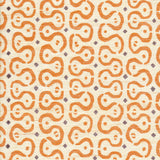 Detail of fabric in a curvilinear stripe pattern in orange and purple on a cream field.