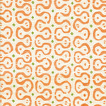 Detail of fabric in a curvilinear stripe pattern in orange and green on a cream field.